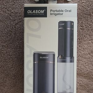 Olasom. Portable Oral Irrigator in Dark Gray